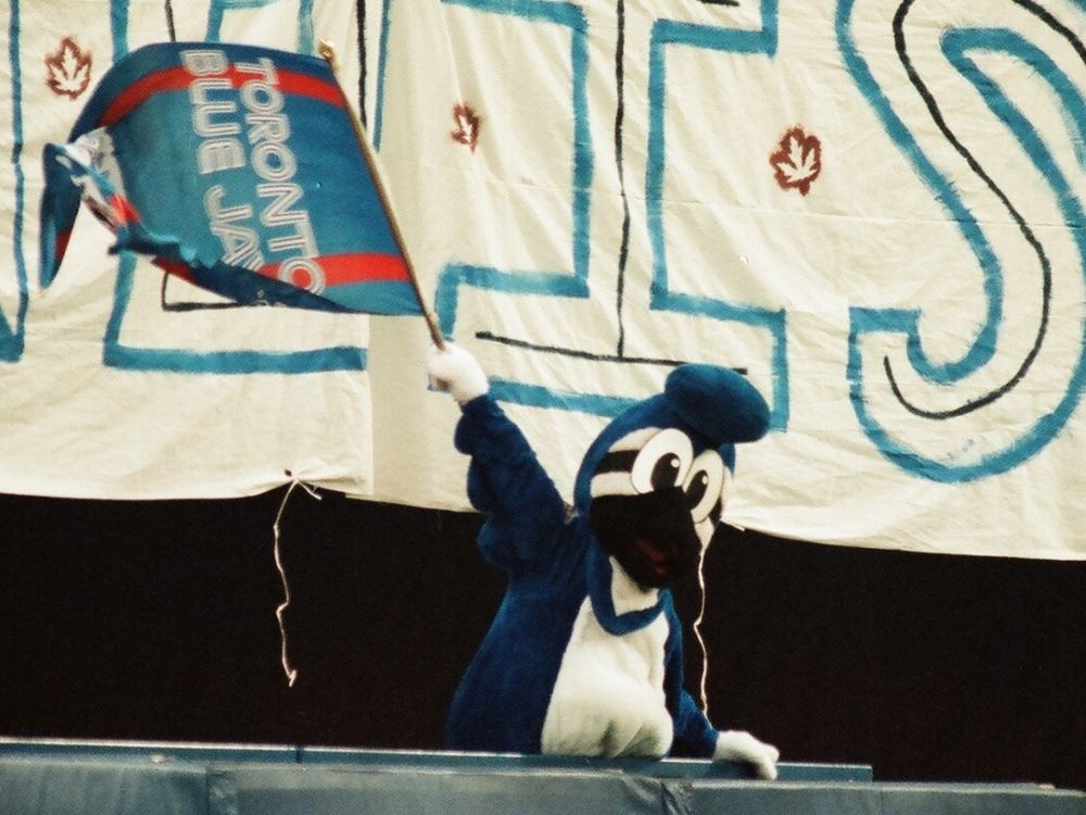 Toronto Blue Jays original mascot BJ Birdy waves flag during the 1993 World Series.