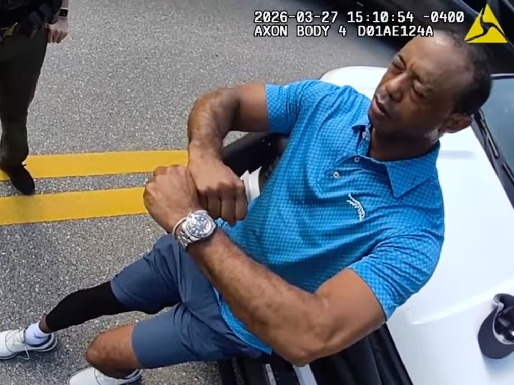 In this image taken from police body camera video released by the Martin County, Fla., Sheriff's Office, golfer Tiger Woods performs a field sobriety test for sheriff's deputies following a car crash in Jupiter Island, Fla., Friday, March 27, 2026.