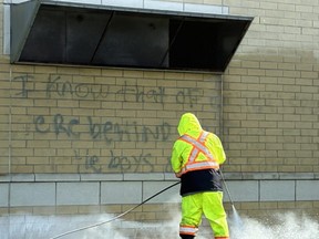 Graffiti is removed frm Mississauga’s St. Aloysius Gonzaga Secondary School.