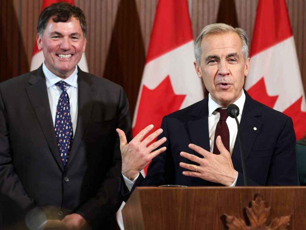Canada's Prime Minister Mark Carney (right) speaks during a news conference, alongside President of the King's Privy Council for Canada Dominic LeBlanc (left) on June 6, 2025.