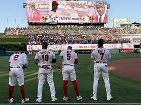 Los Angeles Angels players stand for a tribute to late former star Garret Anderson.