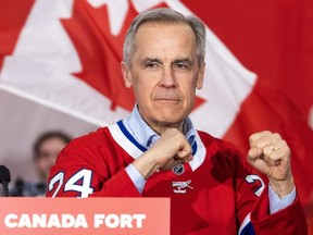 Mark Carney strikes a fighter's pose at a campaign rally