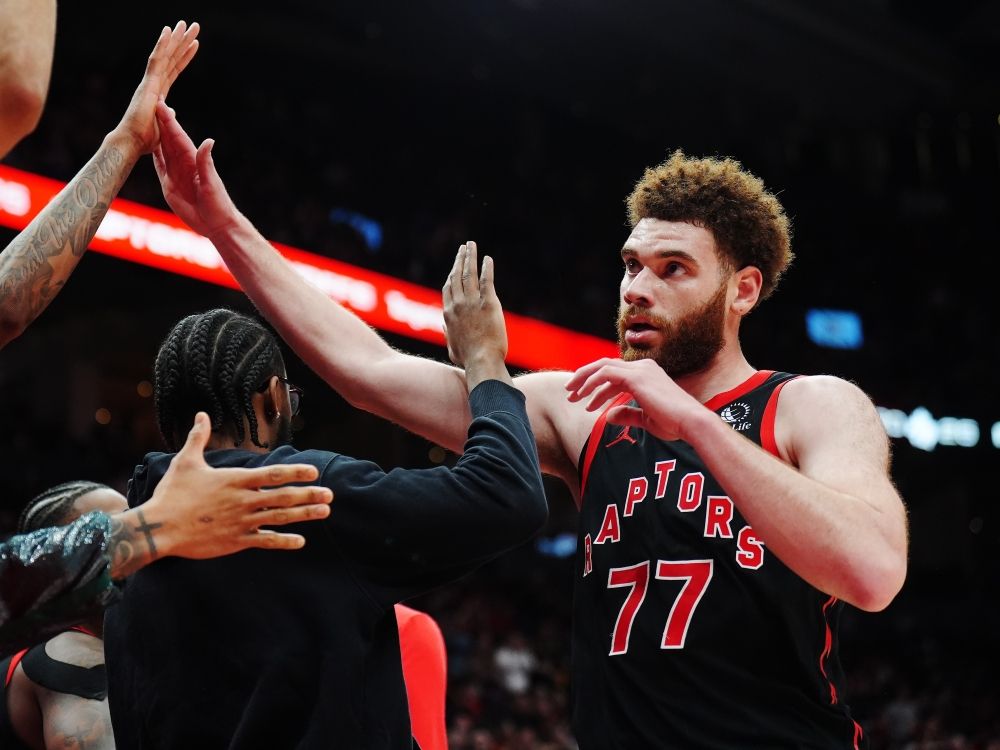 Toronto Raptors' Jamison Battle is congratulated by teammates during Game 3 against the Cleveland Cavaliers.