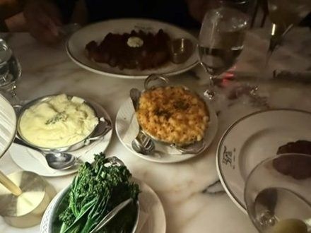 Table of food at 1587 Prime, the Kansas City steakhouse co-owned by Chiefs players Patrick Mahomes and Travis Kelce.