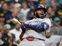 Toronto Blue Jays' Vladimir Guerrero Jr. ducks to avoid being hit by a pitch during the sixth inning of a baseball game against the Milwaukee Brewers, Wednesday, April 15, 2026, in Milwaukee.