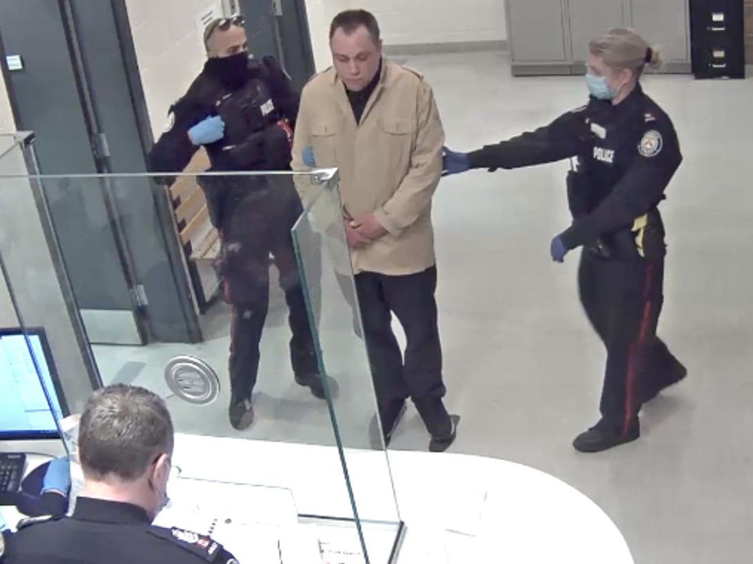 Toronto police booking video shows Colin Hatcher, then 37, after he was arrested for the murder of his mom Kathleen Boyle Hatcher in King's Mill Park in Etobicoke in February 2021.