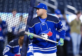 Jays outfielder George Springer wears a fan giveaway Ernie Clement hockey jersey ahead of the game against the Boston Red Sox on Tuesday. Mark Blinch/Getty Images