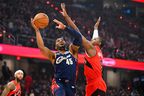 Cleveland's Donovan Mitchell #45 of the Cleveland Cavaliers shoots over RJ Barrett of the Toronto Raptors during Game 2 of their NBA playoff series Monday night.