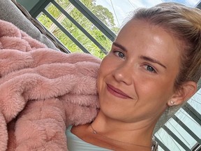 Selfie of Elizabeth Smart wrapped in a pink fuzzy blanket.