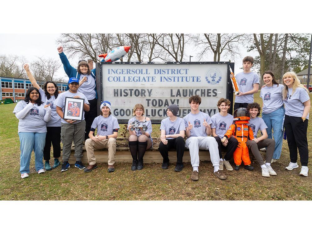 Students at Ingersoll District Collegiate Institute in front of a school sign marking the Artemis II launch and celebrating former student and astronaut Jeremy Hansen. Photo taken on Wednesday, April 1, 2026. (Mike Hensen/The London Free Press)