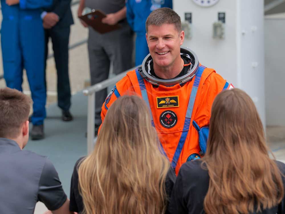 Mission specialist Jeremy Hansen of CSA (Canadian Space Agency) speaks to his family as he walks out of the Neil A. Armstrong Operations and Checkout Building ahead of the launch of the Artemis II at NASA’s Kennedy Space Center on April 1, 2026 in in Cape Canaveral, Fla.