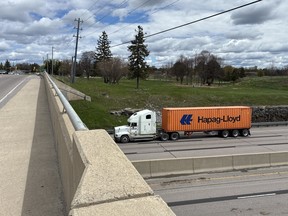 A transport truck passes under the Sydenham Rd. overpass on Monday, May 11, 2026, in Kingston, Ont.