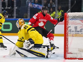 Team Canada's John Tavares celebrates scoring his team's first goal against Team Sweden goaltender Magnus Hellberg during the IIHF Ice Hockey Men's World Championship.