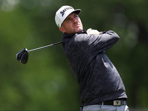 Taylor Pendrith of Canada plays a shot