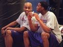 Vince Carter talks with Tracy McGrady at a Toronto Raptors practice in 2000.