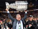 General Manger Kelly McCrimmon of the Vegas Golden Knights lifts the Stanley Cup after his team defeated the Florida Panthers on June 13, 2023.