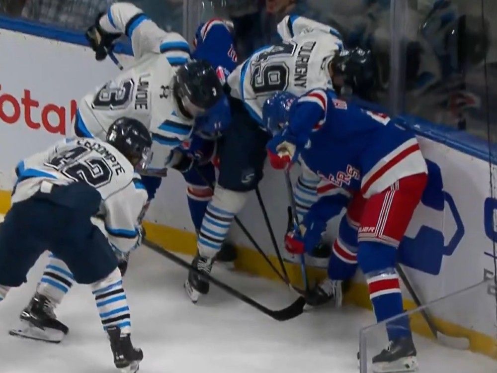 Chicoutimi Sagueneens defenceman Jordan Tourigny stomps on the skate of Rangers winger Christian Humphreys.