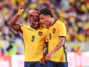 Ecuador’s John Yeboah (left) and Anthony Valencia celebrate a goal against Saudi Arabia in a game prior to the World Cup.