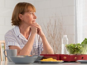 A sad older mother.