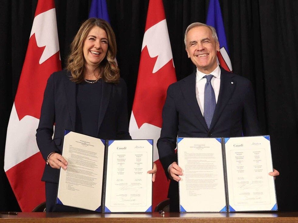 Alberta Premier Danielle Smith and Prime Minister Mark Carney meet in Calgary, Alta on Friday, May 15, 2026. The federal and Alberta governments have advanced a climate and energy agreement that could see construction on an oil pipeline to the West Coast start as early as September 2027. The agreement builds on the memorandum of understanding that the Alberta and federal governments signed in November.
