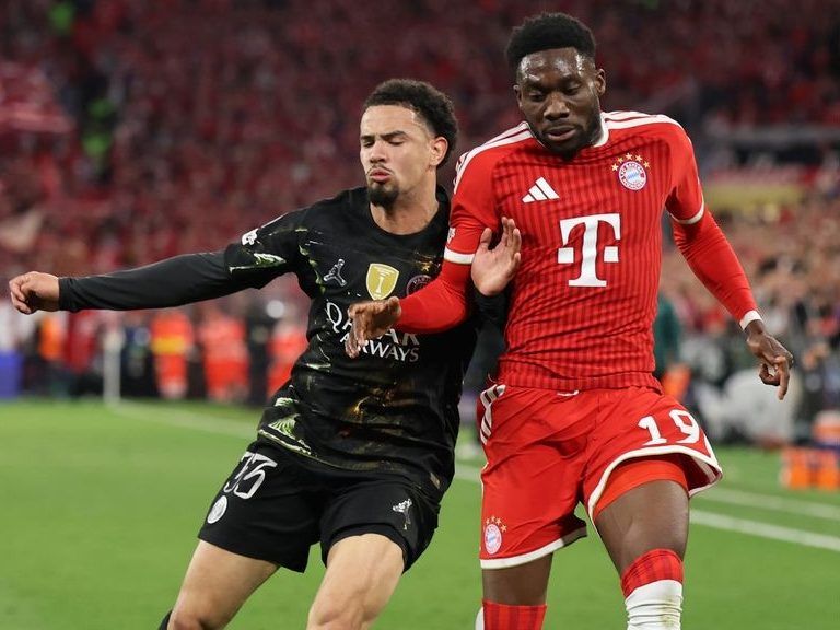 Alphonso Davies of FC Bayern Munich, right, is challenged by Warren Zaire-Emery of Paris Saint-Germain during the UEFA Champions League 2025/26 Semi Final Second Leg match between FC Bayern München and Paris Saint-Germain at Football Arena Munich on May 06, 2026.