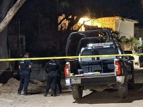Cops at the scene of the murder of a young Canadian man in Mexico. FACEBOOK