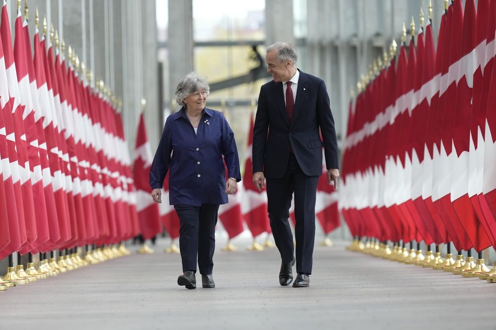 Prime Minister Mark Carney walks with Louise Arbour to announce the new Governor General during an event in Ottawa, Tuesday, May 5 2026. 