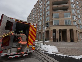 A firefighter at two highrises in Thorncliffe Park in 2025.