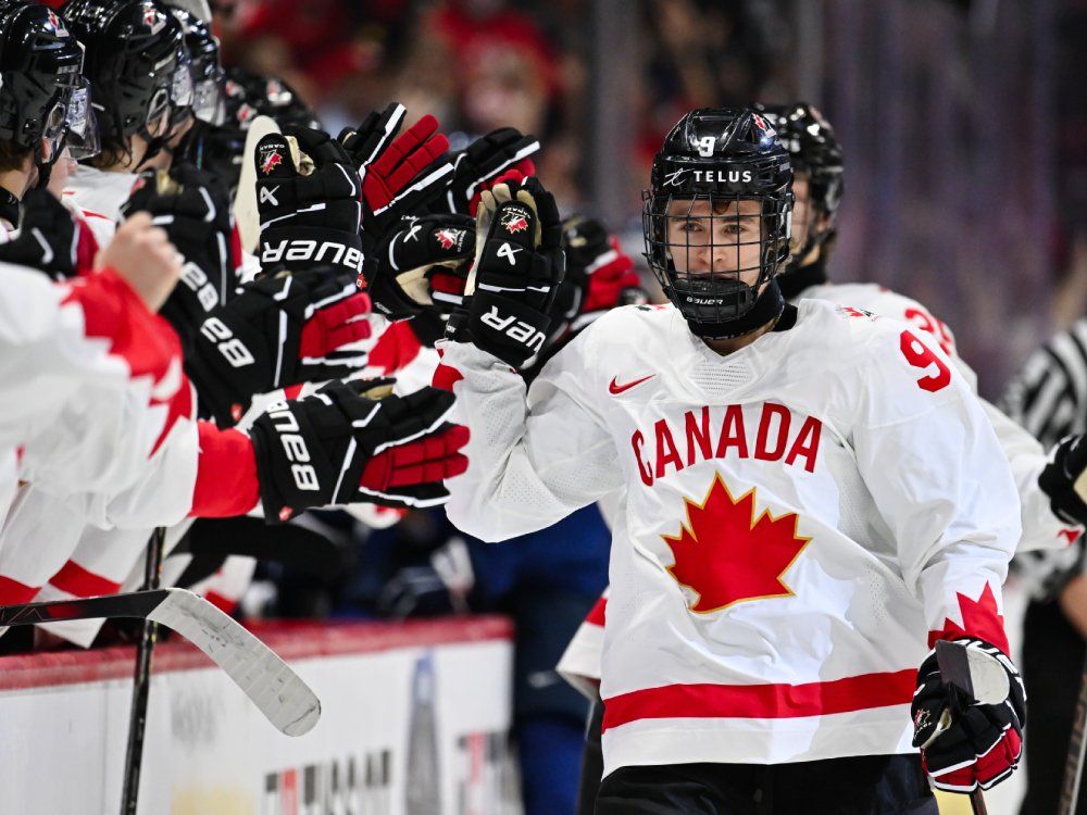 OTTAWA, CANADA - Gavin McKenna #9 of Team Canada celebrates his goal with teammates on the bench during the first period at the 2025 IIHF World Junior Championship against Team Finland at Canadian Tire Centre December 26, 2024 in Ottawa, Ontario, Canada. 