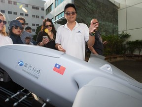 Allan Chi of Thunder Tiger Group — a Taiwanese military drone manufacturer —demonstrates their C-230 Overkill one way attack drone at their company headquarters in Taichung on Tuesday, May 19 2026