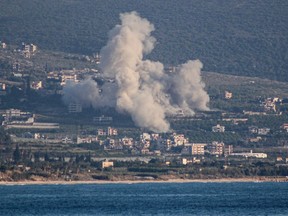 Smoke rises from the site of an Israeli strike that targeted the southern Lebanese village of Mansoura on Saturday, May 23, 2026.