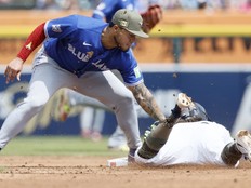 Blue Jays second baseman Lenyn Sosa tags out Zach McKinstry of the Tigers trying to steal second base during seventh inning MLB action at Comerica Park in Detroit, Saturday, May 16, 2026.