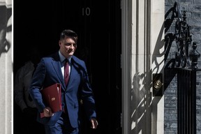 Britain's Health Secretary Wes Streeting exits the door of 10 Downing Street after attending a cabinet meeting in central London on Tuesday.