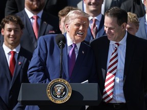 U.S. President Donald Trump jokes with Indiana Head Coach Curt Cignetti during an event to celebrate the 2026 Football National Champion Indiana Hoosiers football team at the White House Monday.