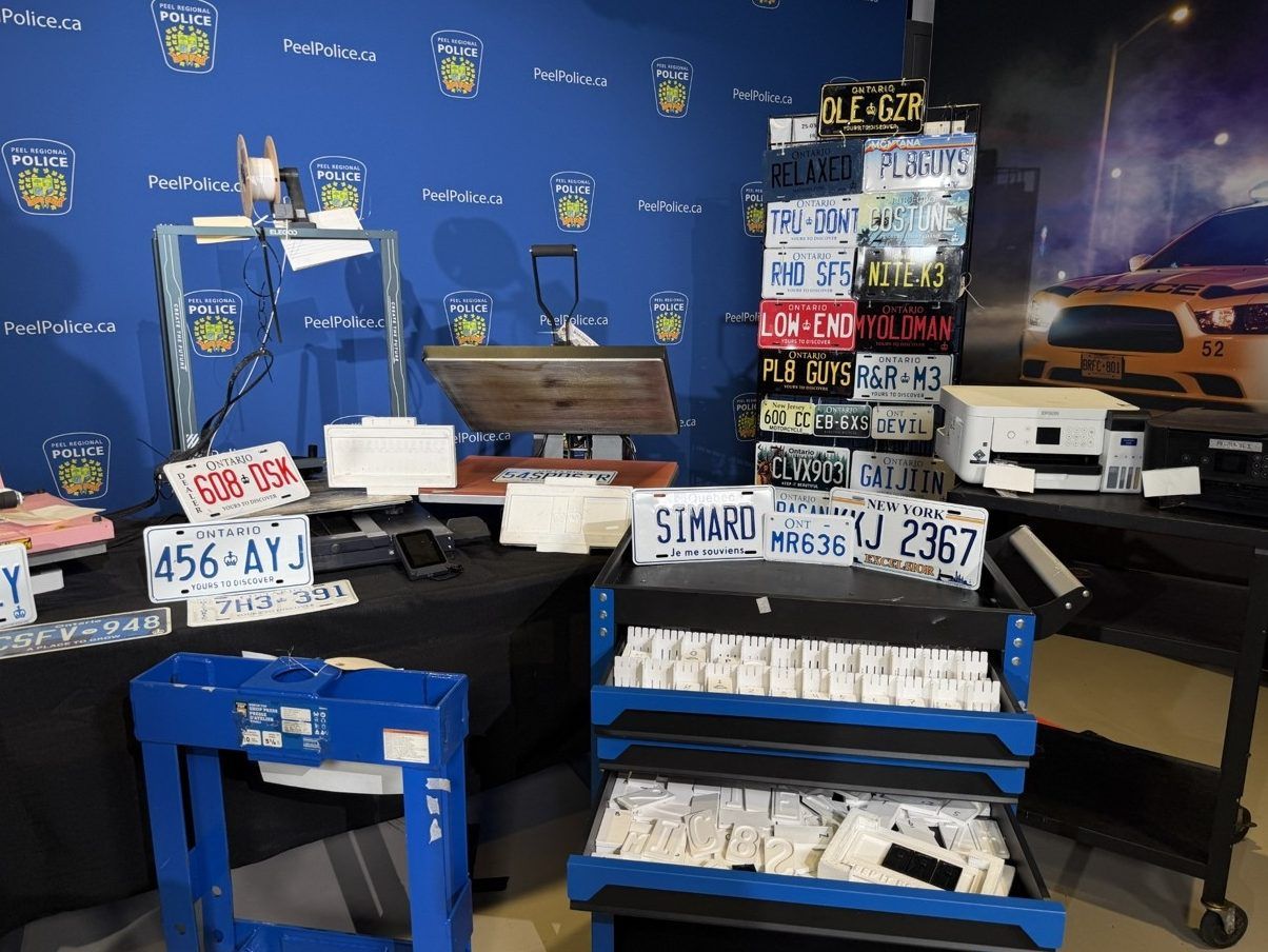 Two brothers were arrested when Peel Regional Police officers seized items allegedly used to produce and distribute counterfeit licence plates while executing search warrants at two Hamilton addresses on April, 7, 2026. 