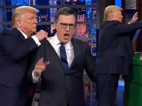 Donald Trump posted an AI video of him tossing Stephen Colbert in a dumpster.