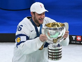 Finland captain Aleksander Barkov celebrates with the trophy