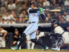 George Springer of the Toronto Blue Jays singles against the New York Yankees at Yankee Stadium last month.