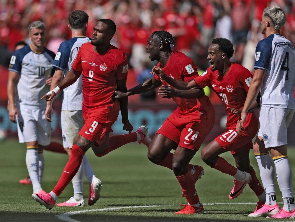 Canada forward Cyle Larin (9) celebrates after scoring a goal during the 2026 World Cup Group B football match between Canada and Bosnia and Herzegovina at the Toronto Stadium in Toronto on June 12, 2026.