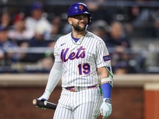 Bo Bichette of the New York Mets walks to the dugout after striking out during a game against the St. Louis Cardinals.