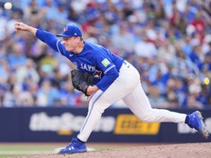 Louis Varland of the Toronto Blue Jays pitches against the New York Yankees.