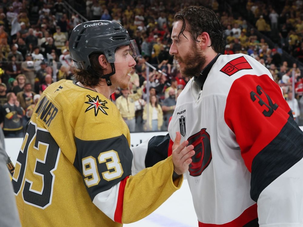Brandon Bussi of the Carolina Hurricanes and Mitch Marner of the Vegas Golden Knights shake hands after Game 6 of the 2026 Stanley Cup Final.