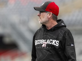 Ryan Dinwiddie, head coach and general manager of the Ottawa Redblacks, stands on the field during the team’s annual Fan Fest earlier this year.