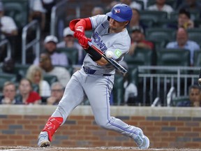 Tyler Heineman of the Toronto Blue Jays hits a two-run double against the Atlanta Braves earlier this month.