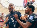 Cyle Larin of Canada celebrates with teammates after scoring his team's first goal during the FIFA World Cup 2026 Group B match against Qatar.