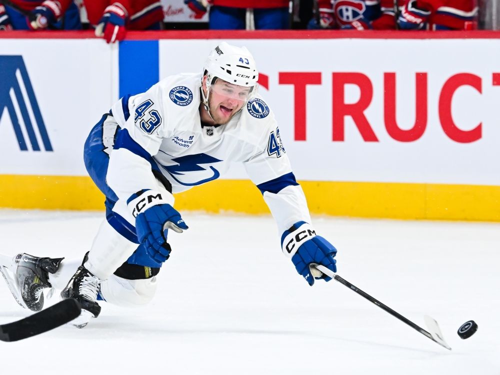 Darren Raddysh of the Tampa Bay Lightning stretches out the stick for the puck against the Montréal Canadiens during the NHL playoffs.