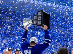 Toronto Marlies captain Logan Shaw lifts the Calder Cup