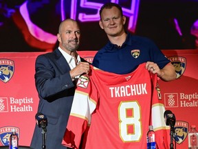 Brady Tkachuk of the Florida Panthers and Bill Zito, general manager of the Florida Panthers.