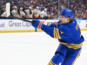 Bowen Byram of the Buffalo Sabres takes a shot during a NHL playoff game this past April.