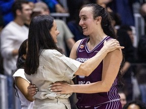 Marina Mabrey (right) hugs head coach Sandy Brondello